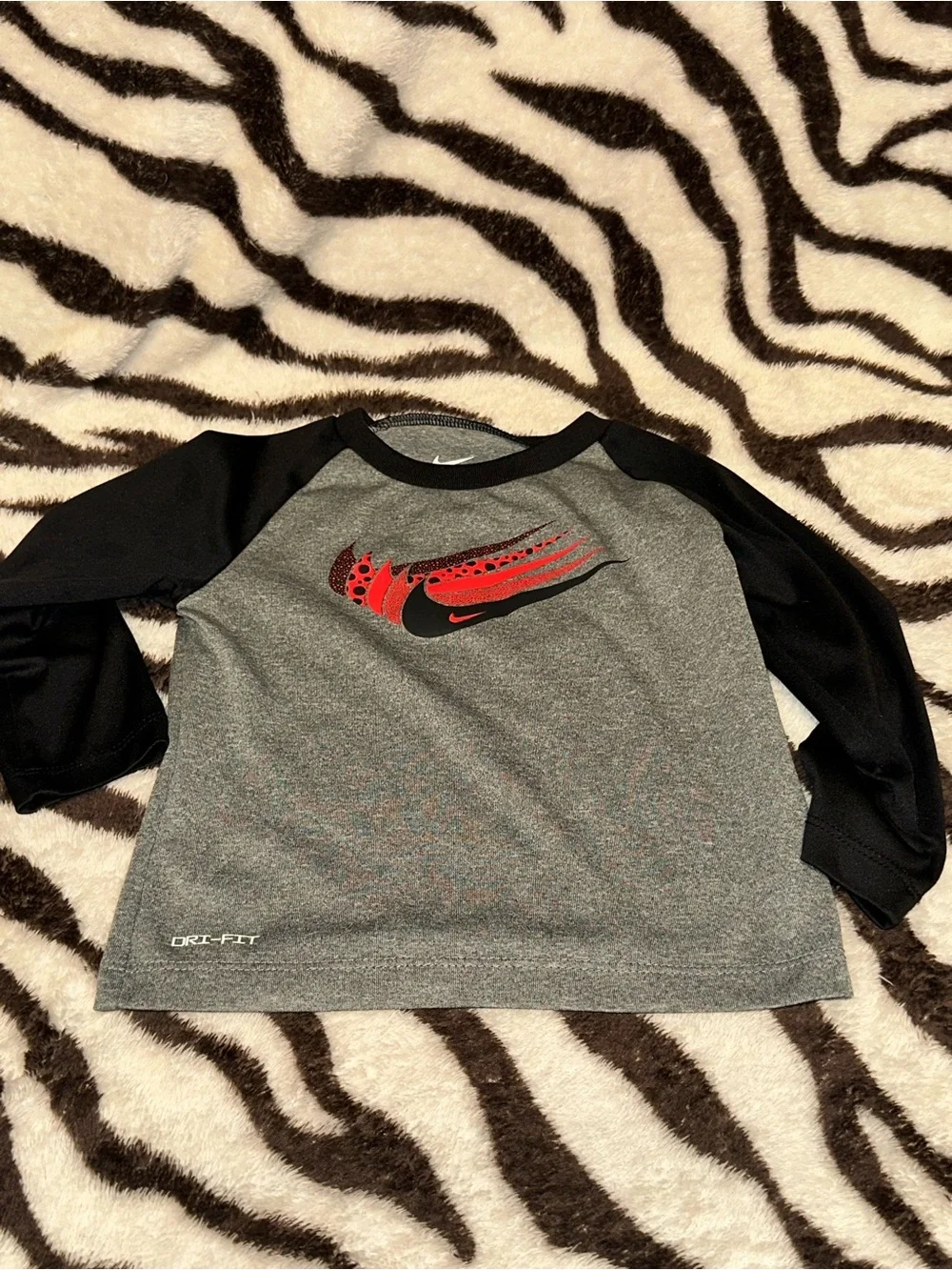Toddler Nike Gray & Black Long Sleeve Dri-FIT Top with Red Swoosh Graphic
